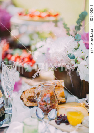 The composition of the wedding table setting. The The composition of the wedding table setting. The 30990061