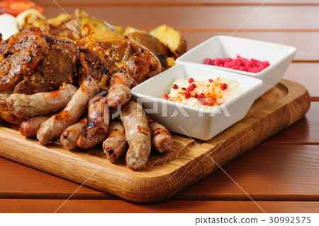 Big grilled meat and vegetables board Big grilled meat and vegetables board 30992575