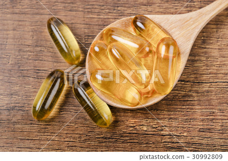 Fish oil capsules with omega 3 and vitamin D. 30992809