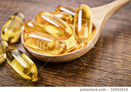 Fish oil capsules with omega 3 and vitamin D. 30992810