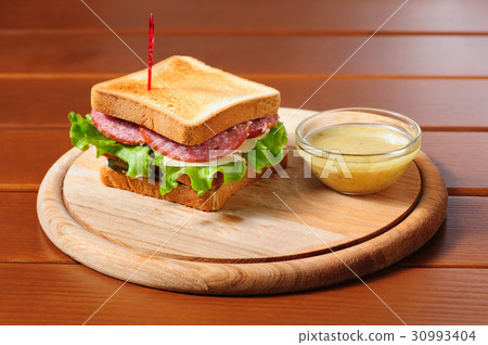 sandvich with cheese, salami and lettuce sandvich with cheese, salami and lettuce 30993404