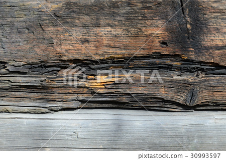 Wall made of wooden logs 30993597