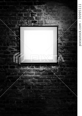 Empty square frame on black brick wall. Blank Empty square frame on black brick wall. Blank 30995111