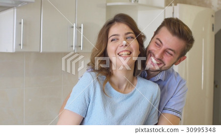 Happy Young Family Spending Time in The Kitchen. 30995348