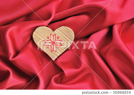 Wooden Heart on red satin background Wooden Heart on red satin background 30998859