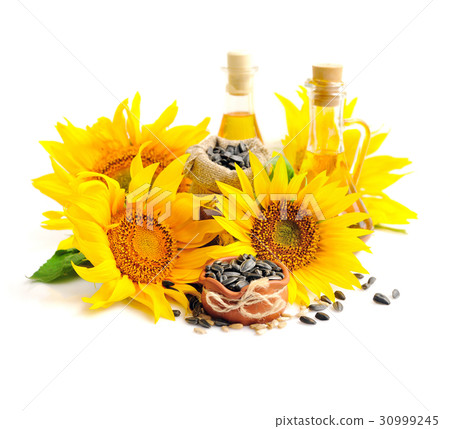 Yellow sunflowers with bottles of oil 30999245