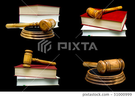 Wooden judge hammer and book on a black background 31000999