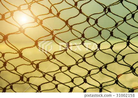 fishing net with sunlight. fishing net with sunlight. 31002158
