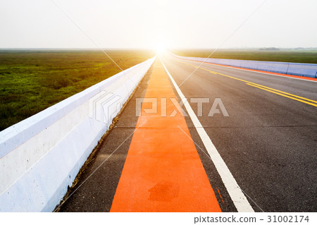 Empty road and the red traffic lines. 31002174