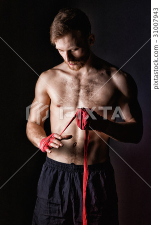 Blond sportsman with boxing bandages Blond sportsman with boxing bandages 31007943