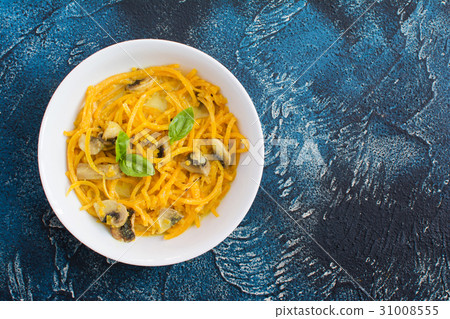 Spiralized butternut squash on the grey table Spiralized butternut squash on the grey table 31008555
