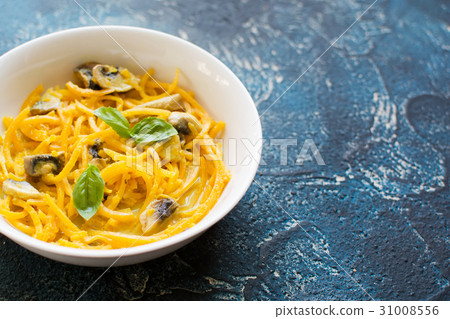 Spiralized butternut squash on the grey table Spiralized butternut squash on the grey table 31008556
