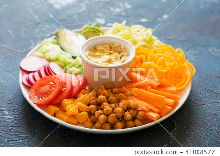 Healthy cut vegetables on the blue table Healthy cut vegetables on the blue table 31008577