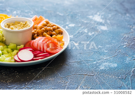Healthy cut vegetables on the blue table 31008582