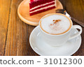 A cup of  coffee and a piece of cake. 31012300