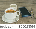 A cup of coffee and mobile phone 31015566