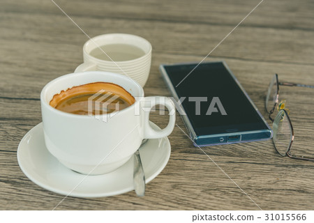 A cup of coffee and mobile phone 31015566