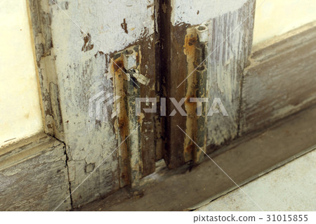 A latch of bar lock at the old wooden door A latch of bar lock at the old wooden door 31015855