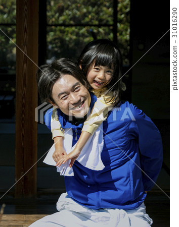 A family relaxing in the countryside living side 31016290