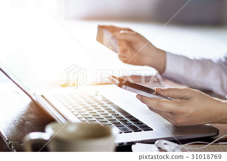 Man using mobile payments credit card for shopping Man using mobile payments credit card for shopping 31018769