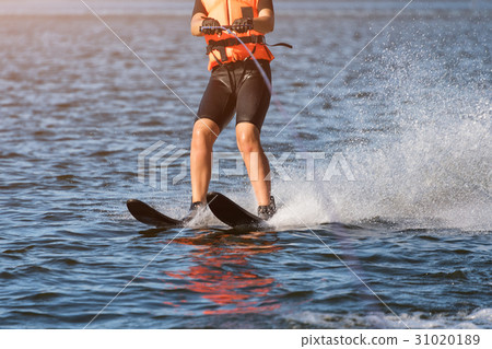 Woman riding water skis closeup. Body parts 31020189