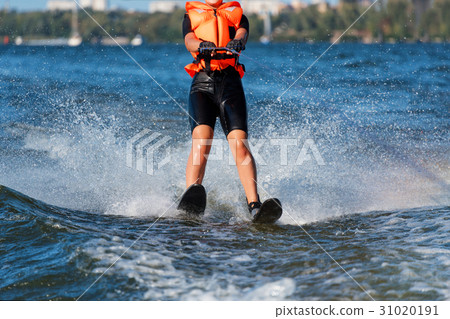 Woman riding water skis closeup. Body parts 31020191