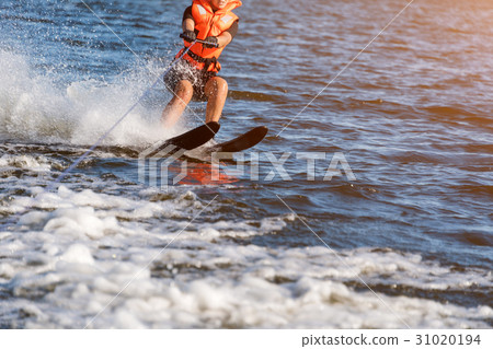Woman riding water skis closeup. Body parts 31020194