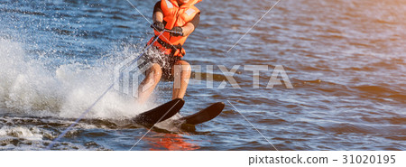 Woman riding water skis closeup. Body parts 31020195