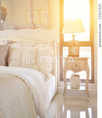 bedroom with classic style table lamp and clock bedroom with classic style table lamp and clock 31022425