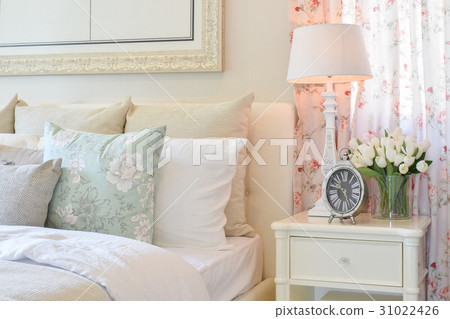 vintage bedroom with decorative lamp, alarm clock vintage bedroom with decorative lamp, alarm clock 31022426