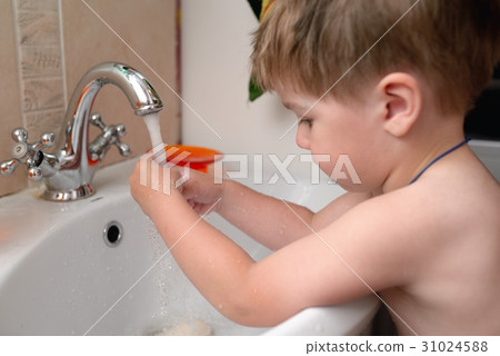 Baby washing hand in bathroom Baby washing hand in bathroom 31024588