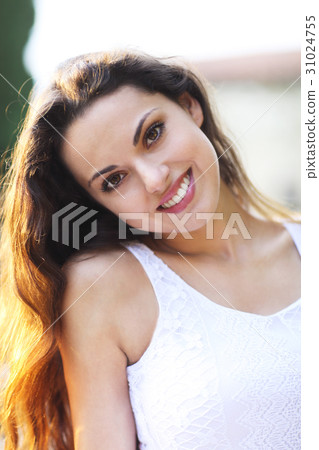Young beautiful woman at summer sunset  31024755