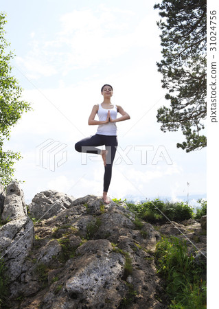Attractive young woman doing a yoga Attractive young woman doing a yoga 31024756