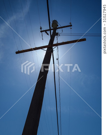 Silhouetted  electric post 31027945