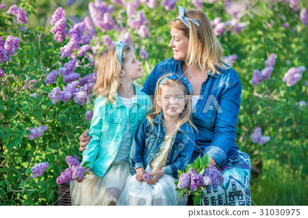 Mother woman with two cute smiling girls sisters 31030975