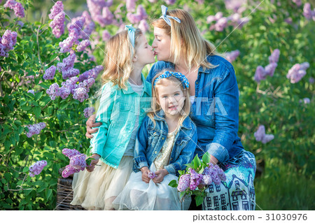 Mother woman with two cute smiling girls sisters Mother woman with two cute smiling girls sisters 31030976