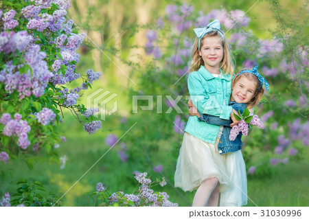 two cute smiling girls sisters lovely together on 31030996