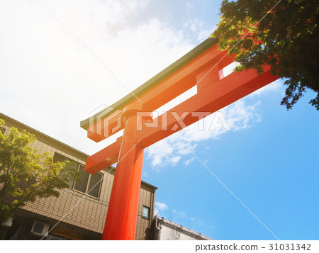 Red Torri gate against blue sky Japanese shrine  31031342