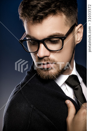 Portrait of handsome young man with glasses  o 31033572