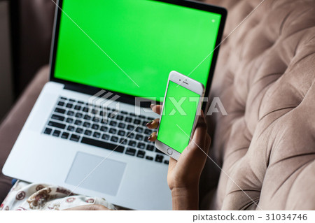 Close up shot of woman's hands holding phone and 31034746