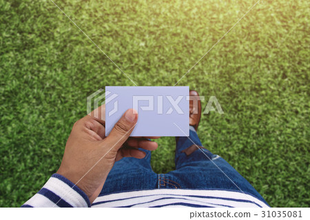 Blank business card on hand for mock up, Top view 31035081