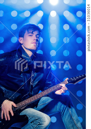 young attractive rock musician playing electric 31036014