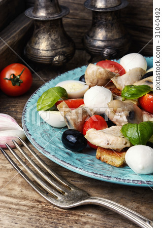 Delicious salad with chicken,cheese,and vegetables Delicious salad with chicken,cheese,and vegetables 31040492