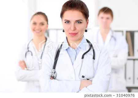 Happy doctor woman  with medical staff at th 31040976