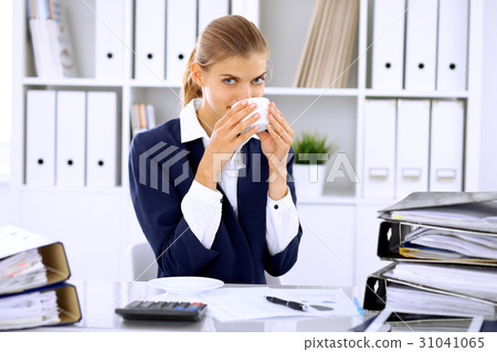 Happy business woman or female accountant having Happy business woman or female accountant having 31041065