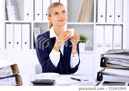 Happy business woman or female accountant having 31041069