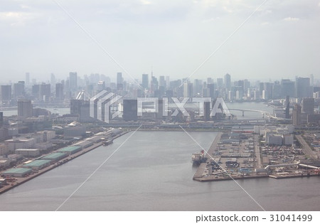 Ariake seen from the sky above Tokyo Bay, landfill near Daiba and rainbow bridge visible in the background and skyscrapers around Minato-ku 31041499