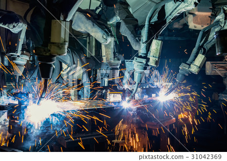 Industrial welding robots are movement in factory 31042369