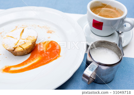 Viennese Apple strudel with fruit sauce on a plate Viennese Apple strudel with fruit sauce on a plate 31049718