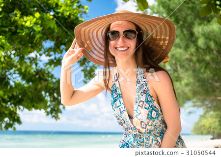 Woman wearing beachwear and sunglasses at tropical Woman wearing beachwear and sunglasses at tropical 31050544